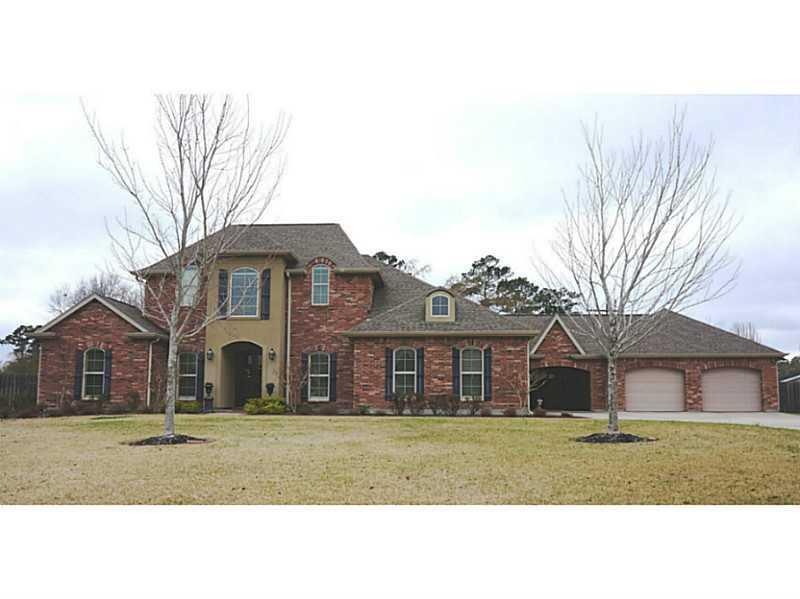 Exterior Front. Landscaped front yard guides sidew