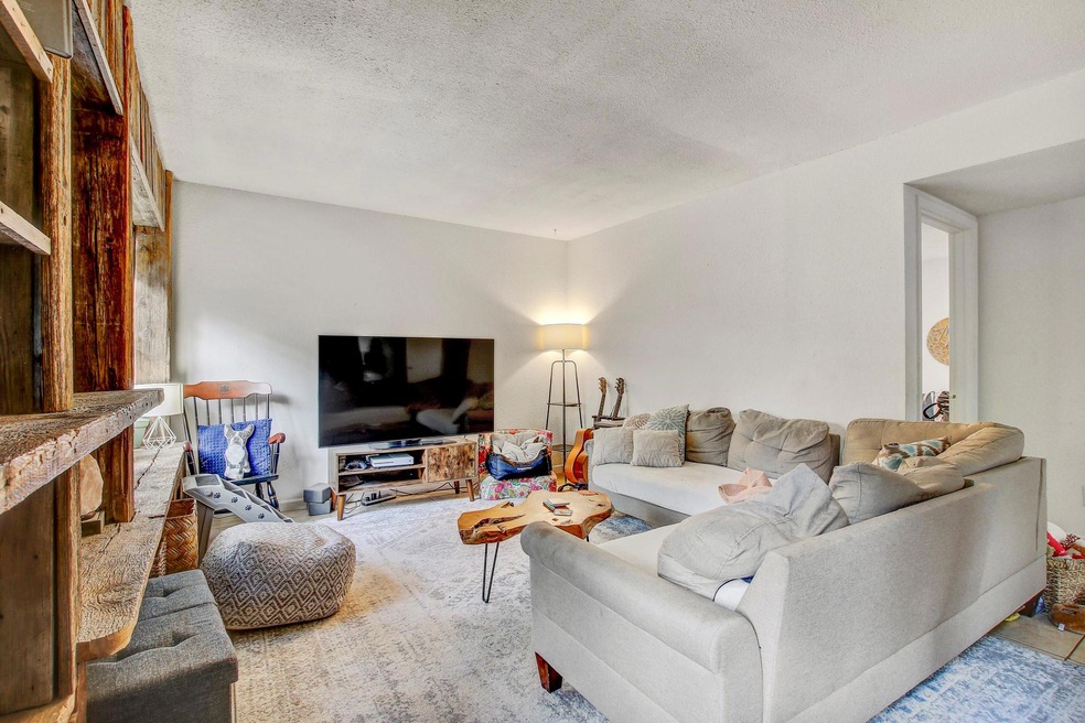 Living area featuring a textured ceiling