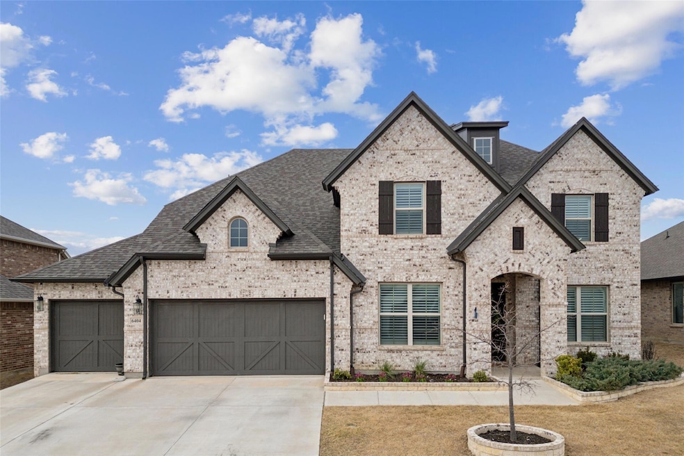 French provincial home featuring a shingled roof, 