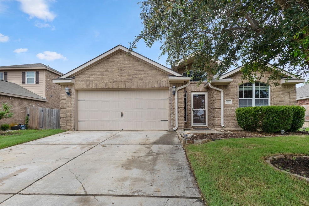 View of front facade with brick siding, an attached garage, and concrete​​‌​​​​‌​​‌‌​​‌​​​‌‌​​​​​​‌‌‌​​‌​​‌‌​​​‌ driveway