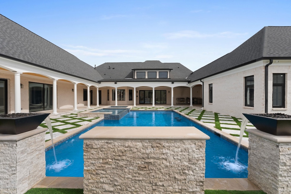 Stunning courtyard-style design centered around a 