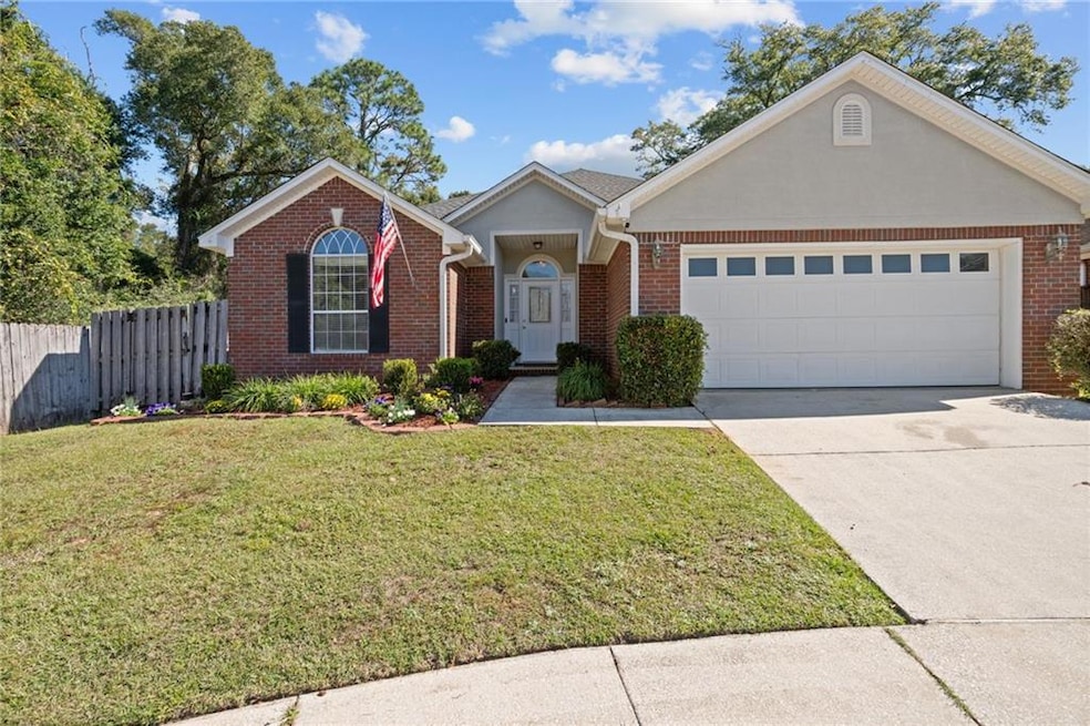 Single story home featuring brick siding, concrete driveway, and a garage