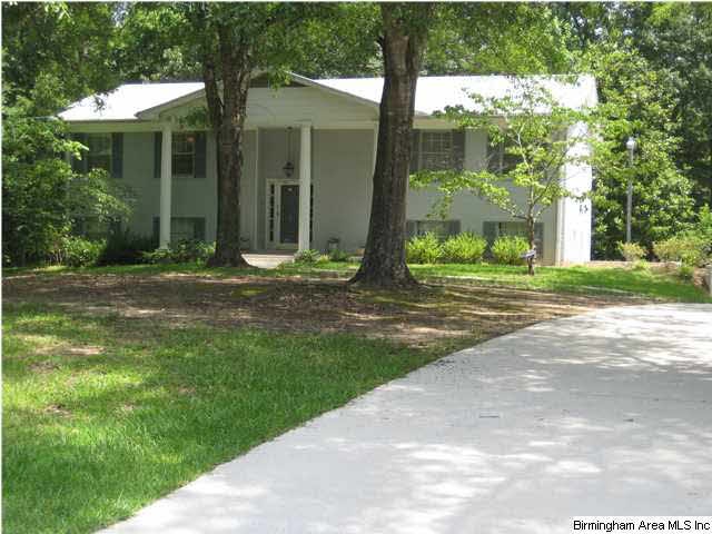 4 sides brick home with beautiful large oak trees 