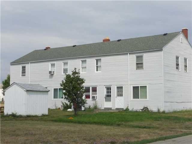 Exterior Front. 4 unit(town house style) vinyl sid