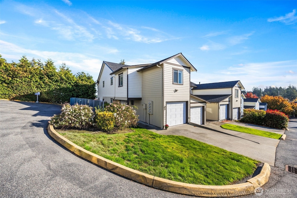 A beautifully maintained end-unit townhome in Oak Harbor offering timeless curb appeal and modern updates.
