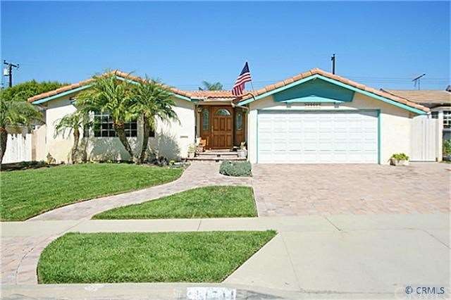Beautiful curb appeal with landscaping and hardsca
