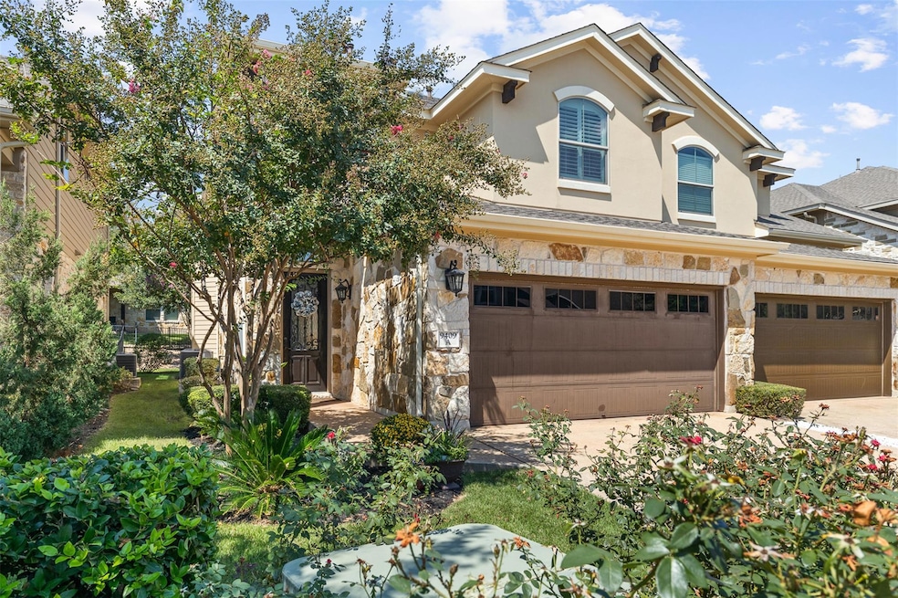 View of front of home with stone siding, stucco s