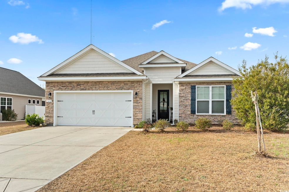 View of front of property with a garage