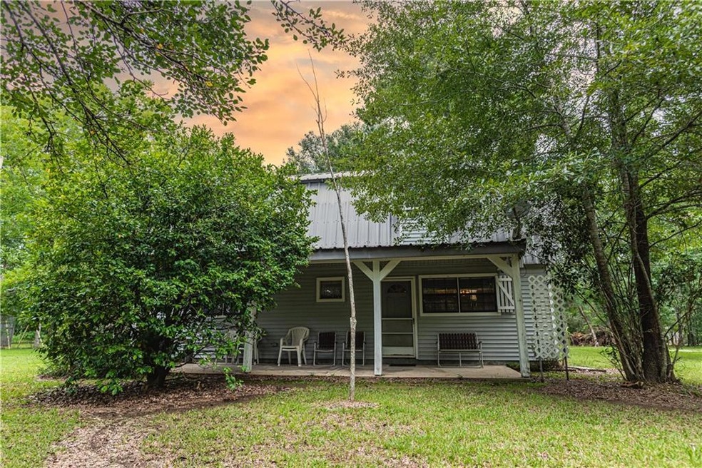 Deep front porch on this solid Country home.