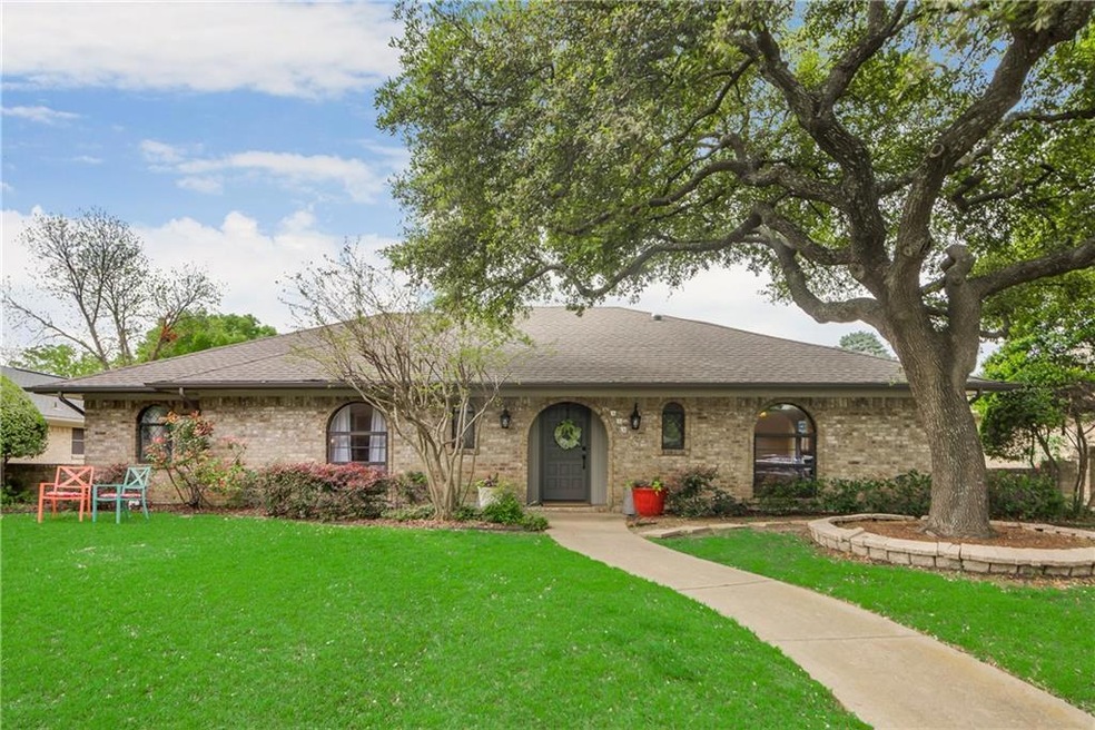 Excellent curb appeal with arched windows and a in
