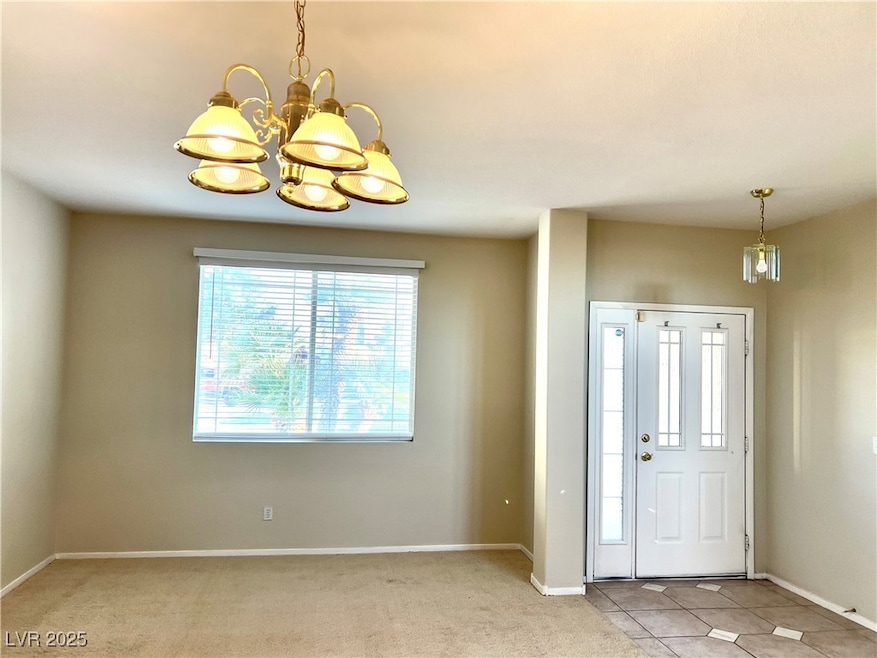 Entrance foyer featuring baseboards, light colored