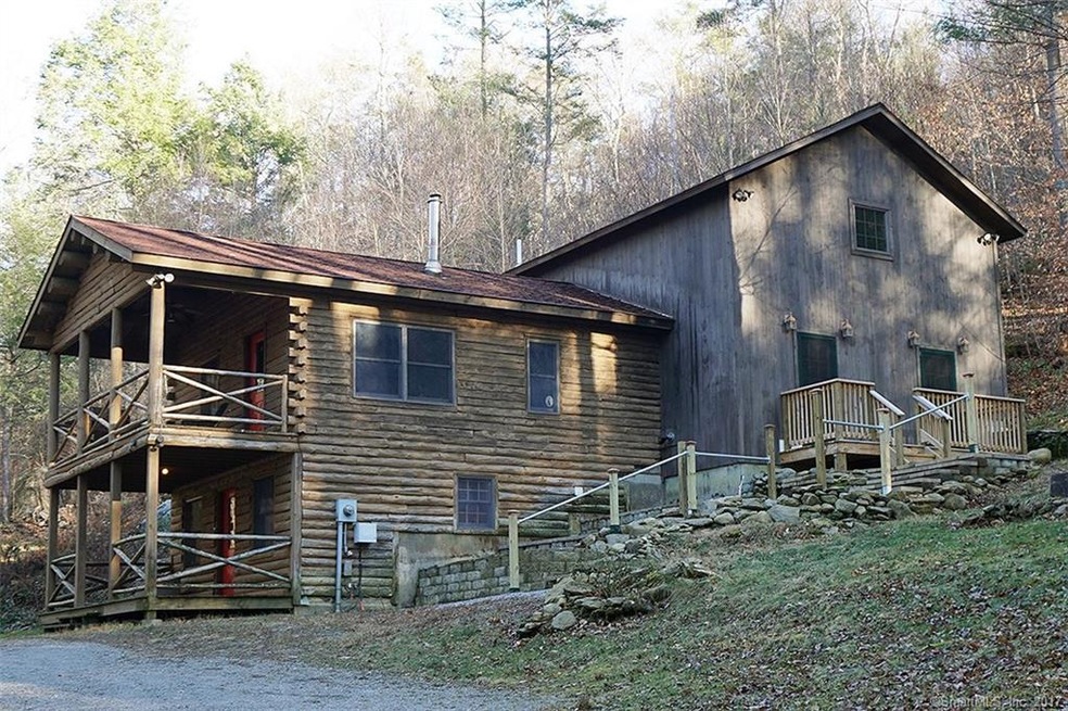 View approaching the log cabin/barn home.