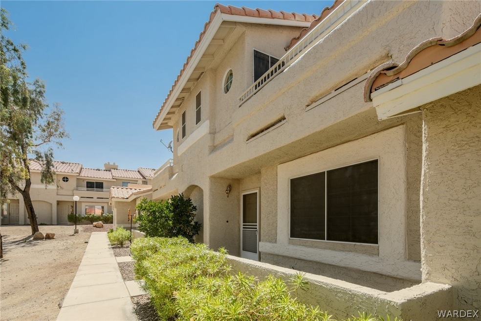 back patio on lower level and upstairs balcony off