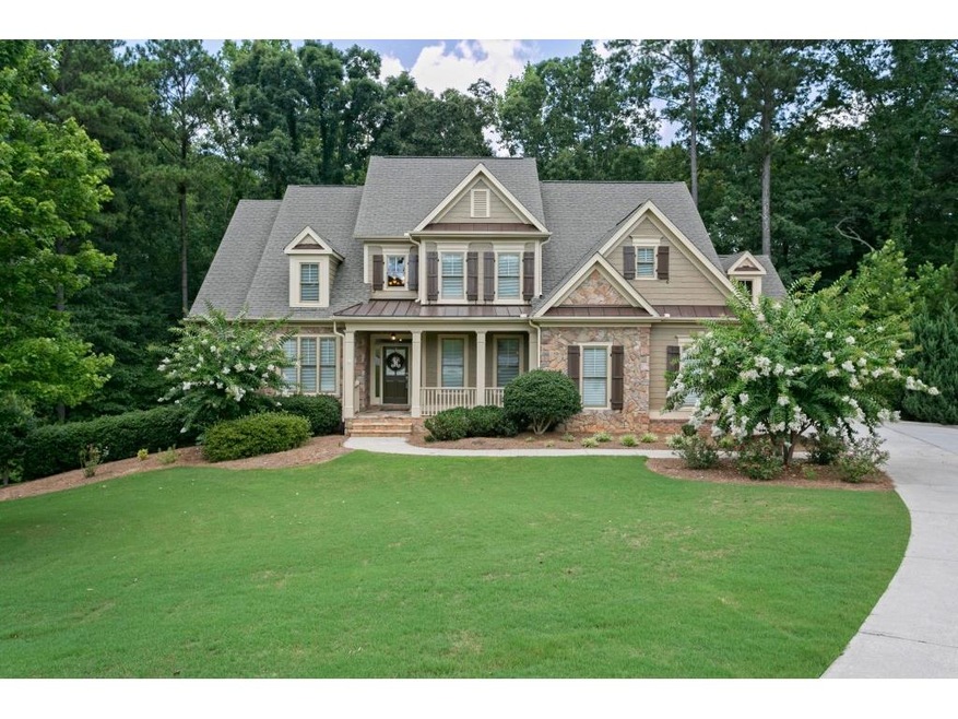 Stunning exterior features shutters, a small porch
