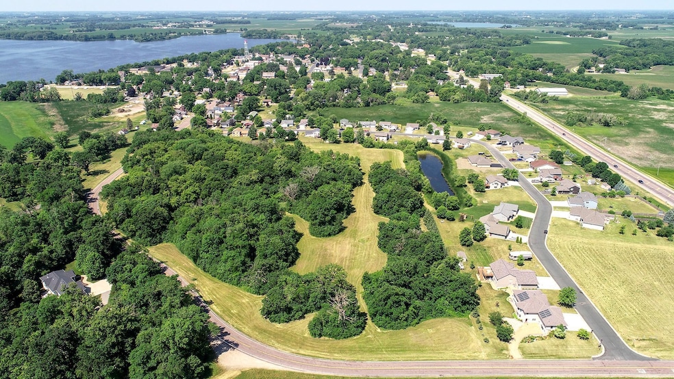 15.3+/- acres bordering development land located off of Hwy 7, East of Silver Lake. Approximately 50 miles West from Minneapolis. Lots of mature trees and a retention pond. Open to any builder.
