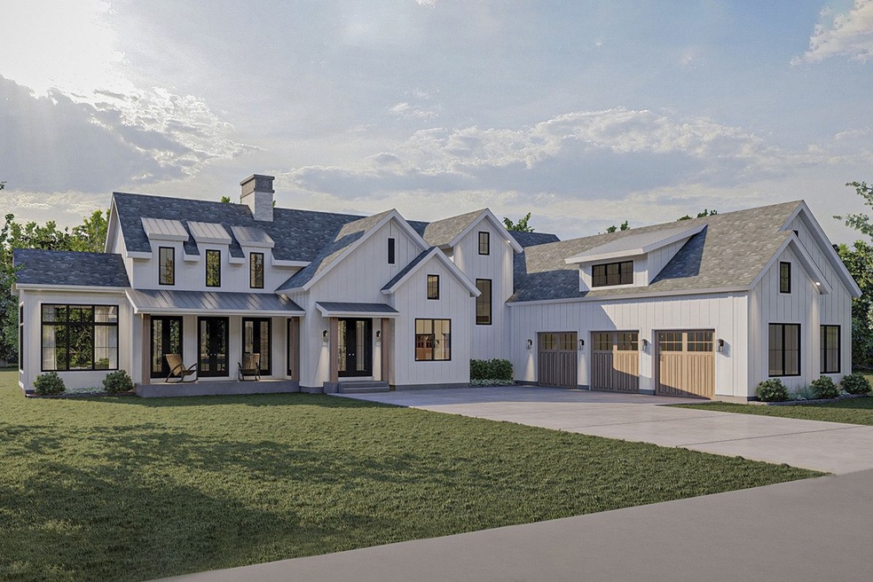 This magnificent Modern Farmhouse plan has an exterior featuring a 3-car courtyard garage.