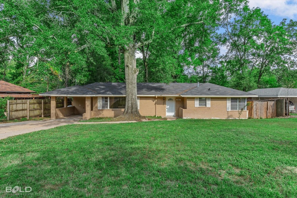 Ranch-style house featuring a carport and a front 