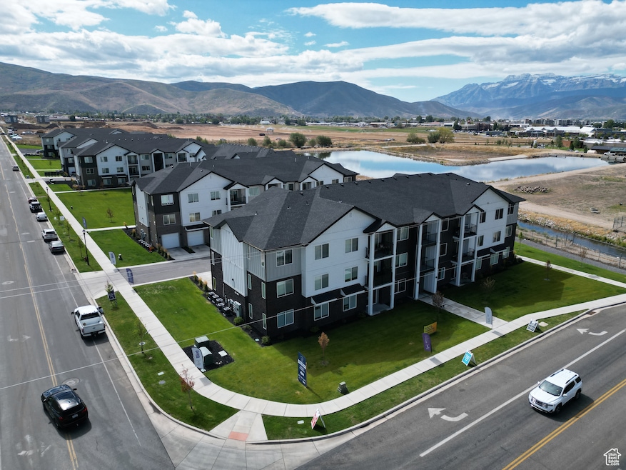 Aerial perspective of suburban area featuring a water and mountain view
