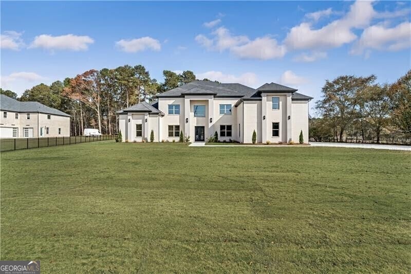 View of front of property with a front yard