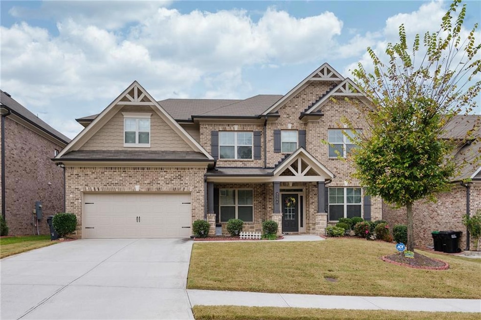 Craftsman-style house featuring a garage, a front 