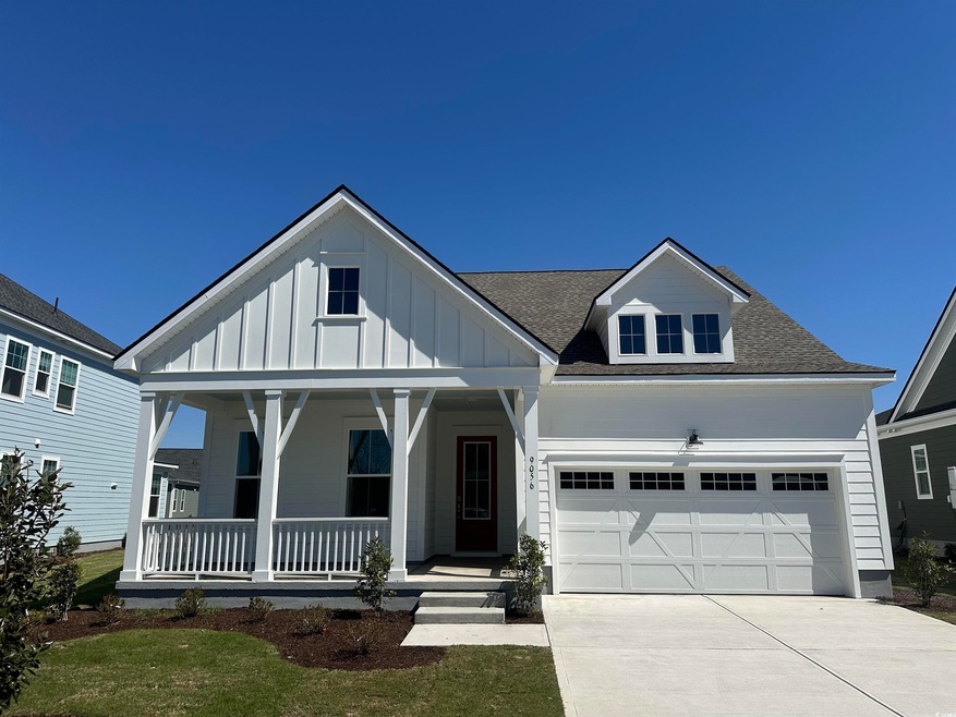 View of front of property featuring board and batt
