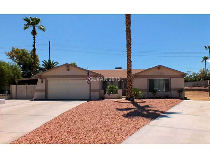 Property Photo. Front of home with desert landscap