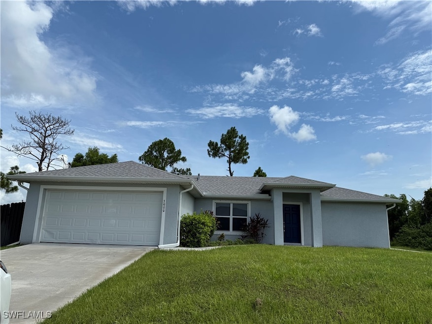 View of front of home with stucco siding, concrete