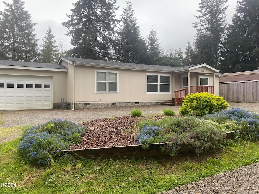 Front of home with flower bed