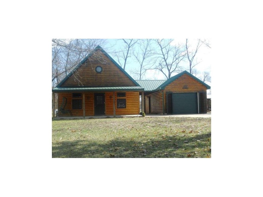 Natural log siding for a true lake house look.