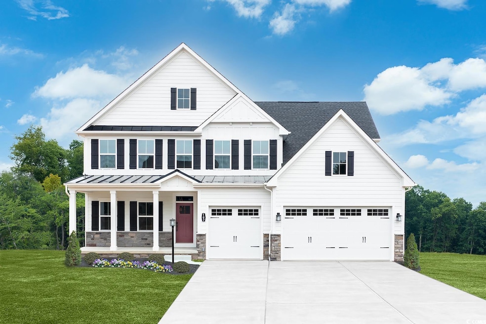 View of front of property with a garage and a fron