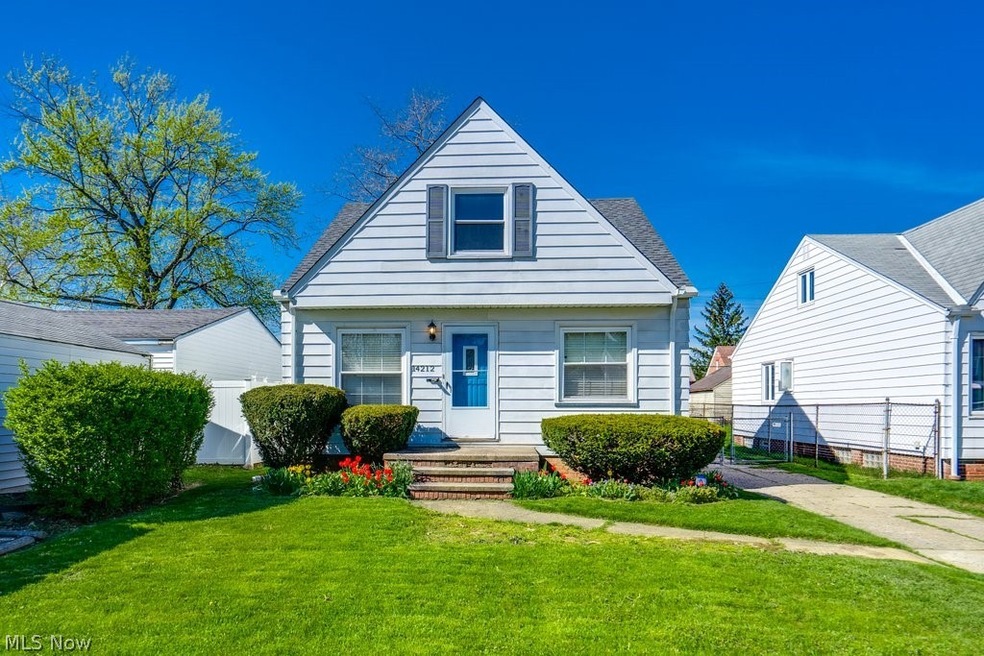 View of front of property with a front yard