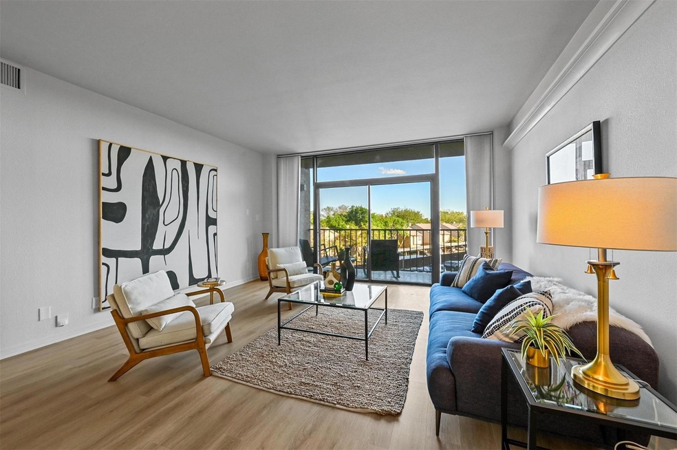 Open concept living room with lux vinyl floors, an