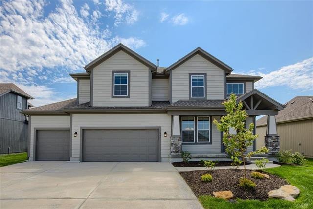 The Brooklyn, by Prieb Homes, features a 3-Car Gar