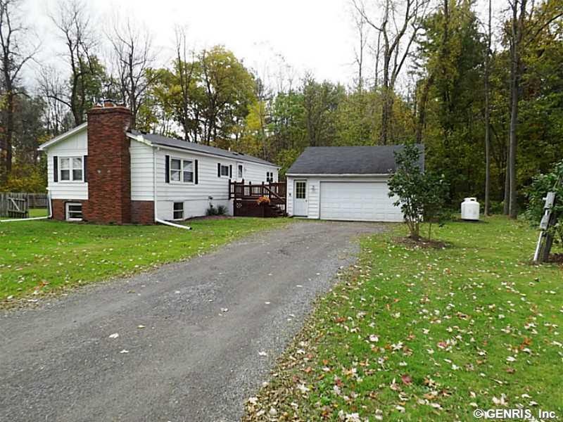 Exterior Front. Big front yard leading to 2-car ga