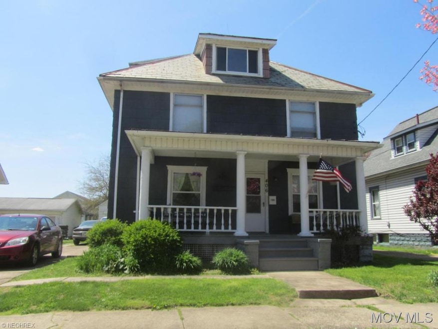 Front with large covered porch