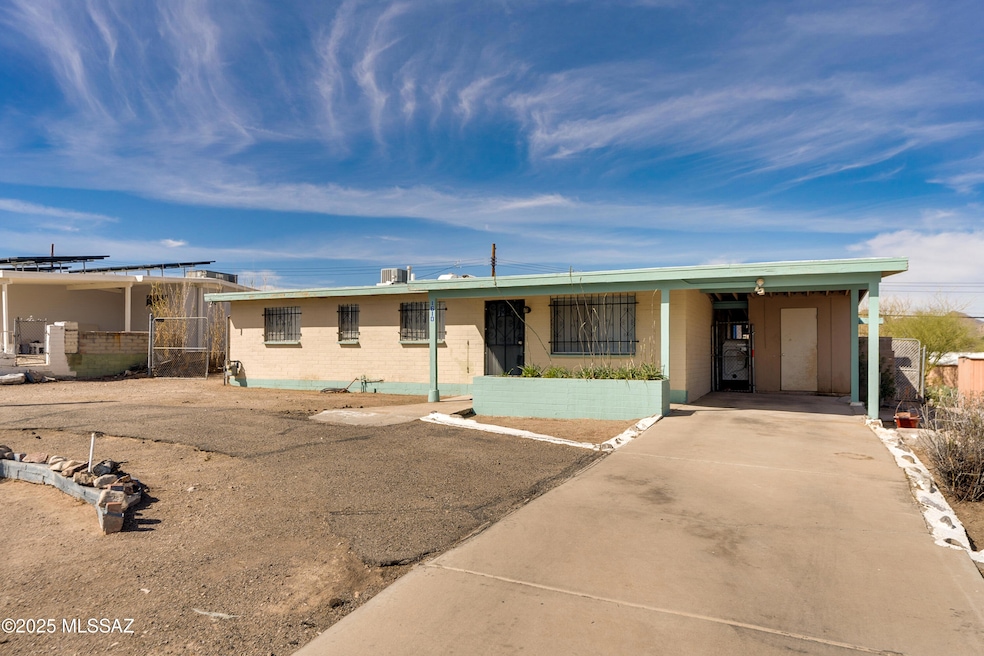 Front, car port and circular driveway.