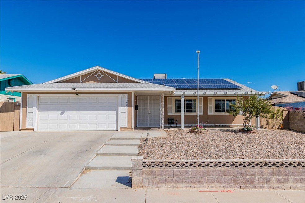 Single story home with stucco siding, fence, drive