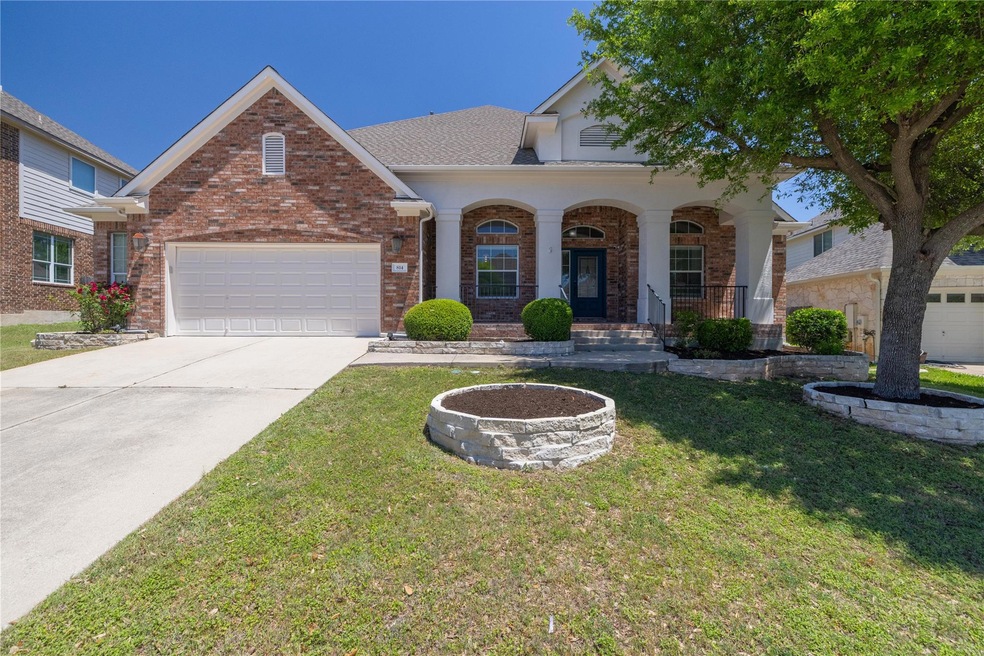 Traditional-style house featuring a front lawn, r
