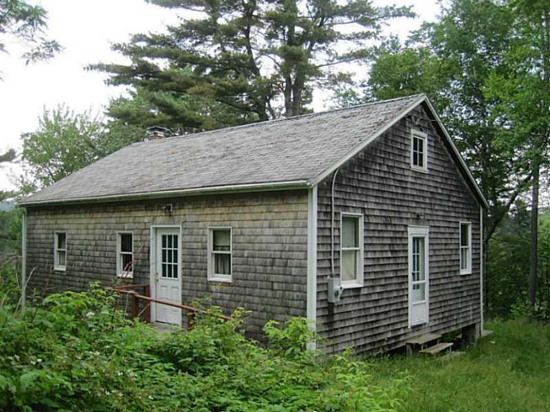Exterior Front. Simple cabin with...