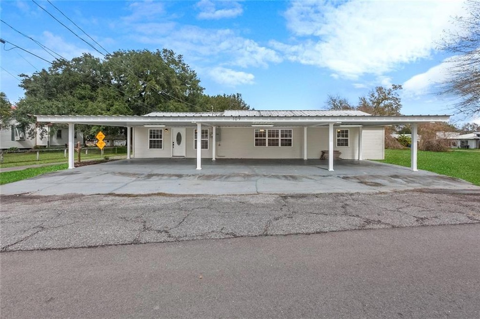 Front of house has a large carport for 3+ cars!