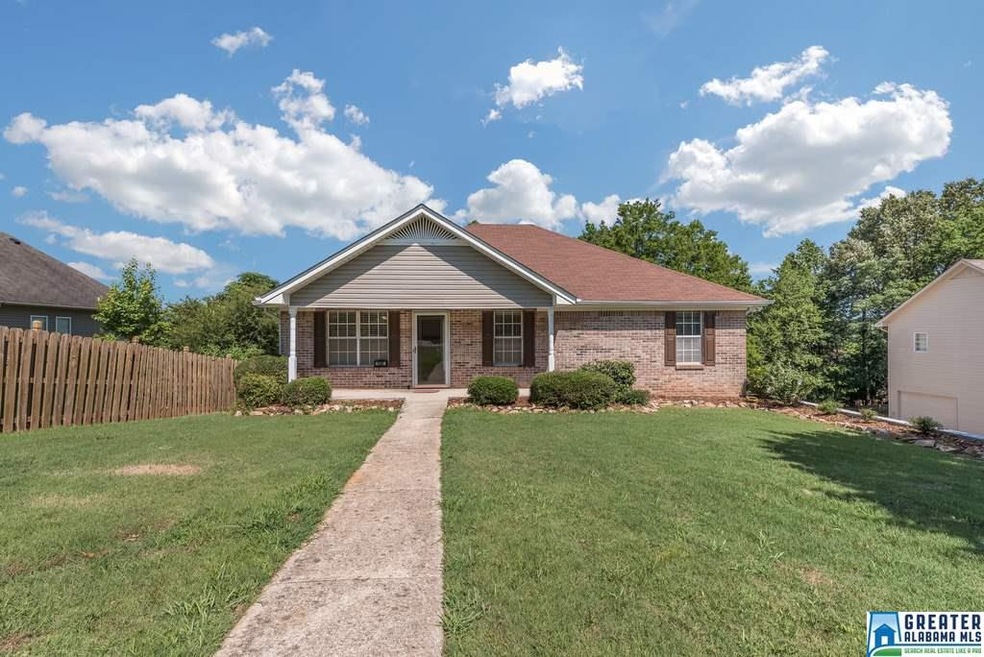 This sweet home has a nice front yard, and plenty 