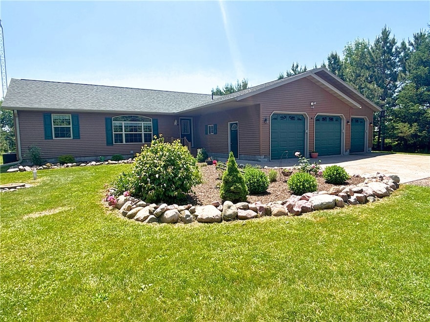 Front Of Home with beautiful rock landscaping and flower beds