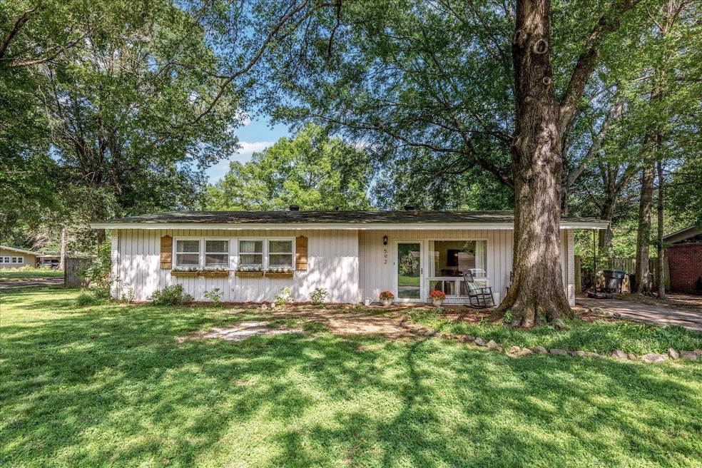 View of front of property with a front yard