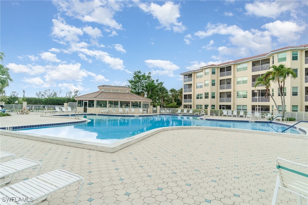 Community pool featuring a patio area