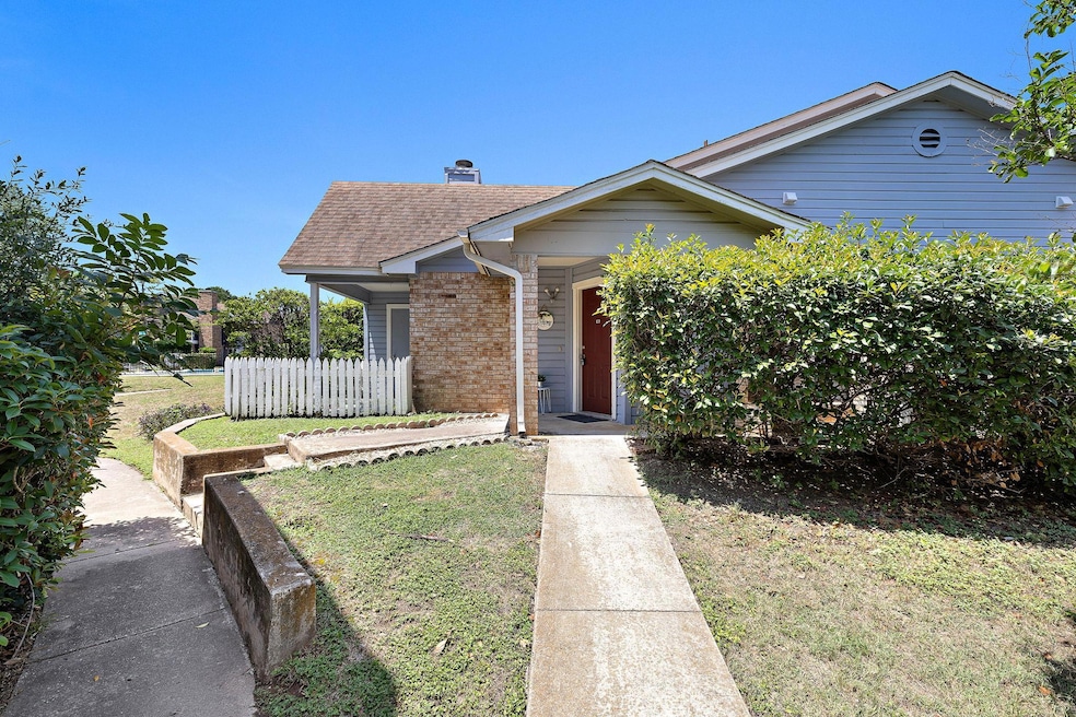 Bungalow-style house featuring brick siding, a sh