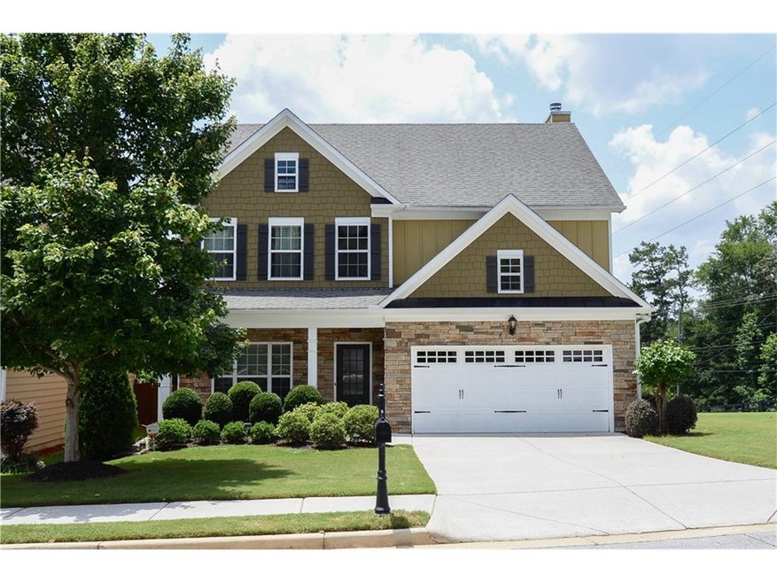 Stacked Stone and Shake front elevation with carri
