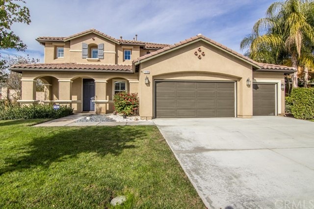 Sitting on a Corner Lot, this 3 car garage home wi