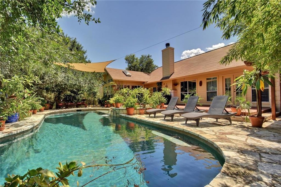 A private backyard oasis with plenty of decking and flagstone.