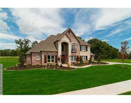 Exterior Front. Brick & Rock facade gives this hom