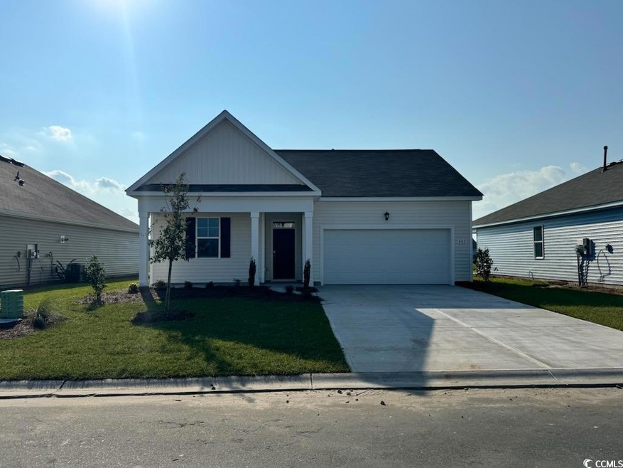 View of front of property with a garage and a fron